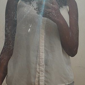 White see-through sleeveless button down top